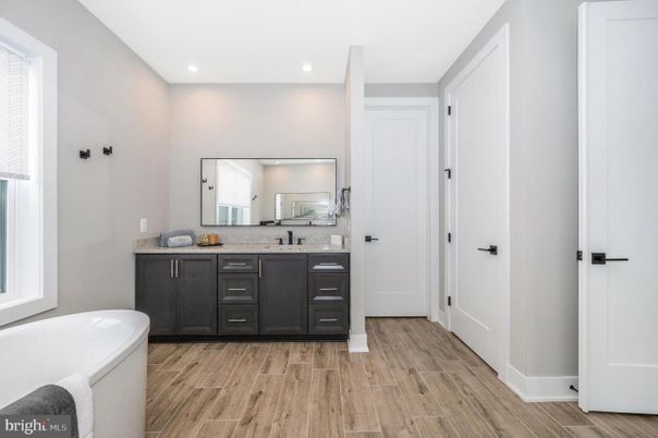 Bathroom, Dual Sink Vanities, Interior, Recessed Lighting, Wood Texture Flooring