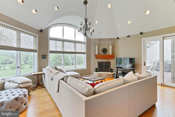 Chandelier, Fireplace, Interior, Living room, Recessed Lighting, Wood Texture Flooring