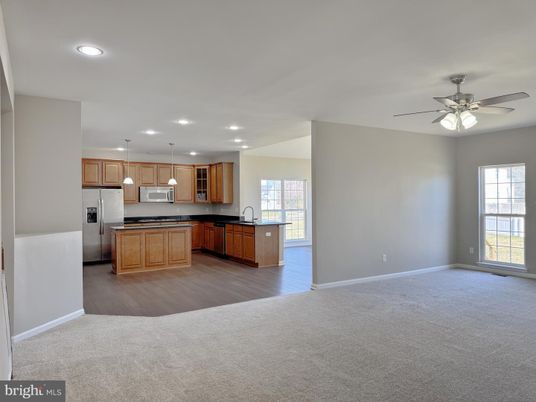 Empty room, Interior, Kitchen, Pendant Lights, Recessed Lighting, Stainless Steel Appliances, Wood Texture Flooring
