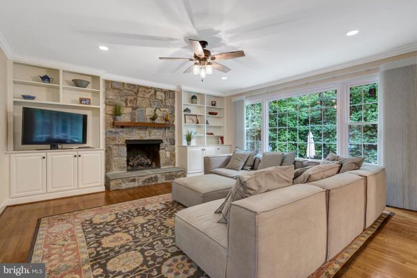 Fireplace, Interior, Living room, Recessed Lighting, Stone Walls, Wood Texture Flooring