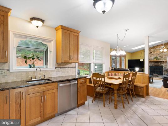 Dining room, Fireplace, Interior, Kitchen, Living room, Pendant Lights, Stainless Steel Appliances, Stone Walls, Wood Texture Flooring