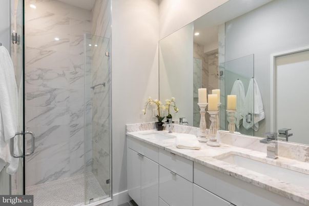 Bathroom, Dual Sink Vanities, Glass Shower, Interior, Marble Walls, Recessed Lighting