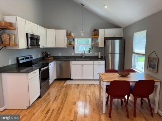 Dining room, Interior, Kitchen, Pendant Lights, Recessed Lighting, Stainless Steel Appliances, Wood Texture Flooring