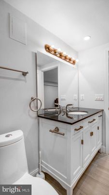 Bathroom, Dual Sink Vanities, Interior, Recessed Lighting, Wood Texture Flooring