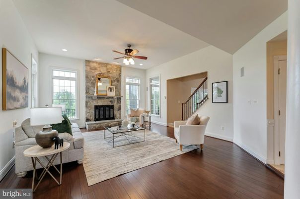 Fireplace, Interior, Living room, Recessed Lighting, Stone Walls, Wood Texture Flooring