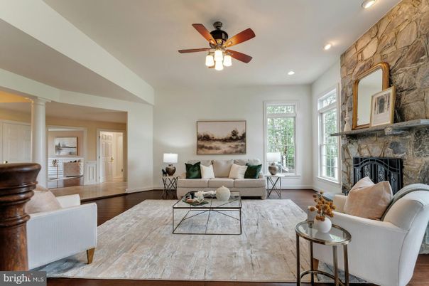 Fireplace, Interior, Living room, Recessed Lighting, Stone Walls, Wood Texture Flooring