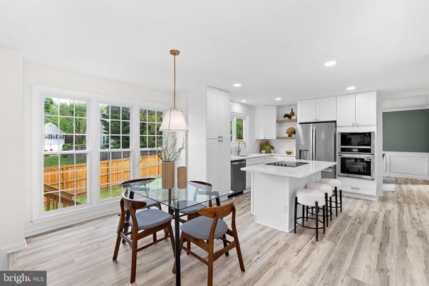 Dining room, Interior, Kitchen, Pendant Lights, Recessed Lighting, Stainless Steel Appliances, Wood Texture Flooring
