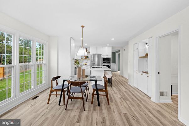 Dining room, Interior, Kitchen, Pendant Lights, Recessed Lighting, Stainless Steel Appliances, Wood Texture Flooring
