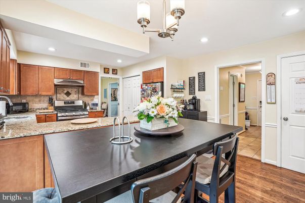 Dining room, Interior, Kitchen, Recessed Lighting, Stainless Steel Appliances, Wood Texture Flooring
