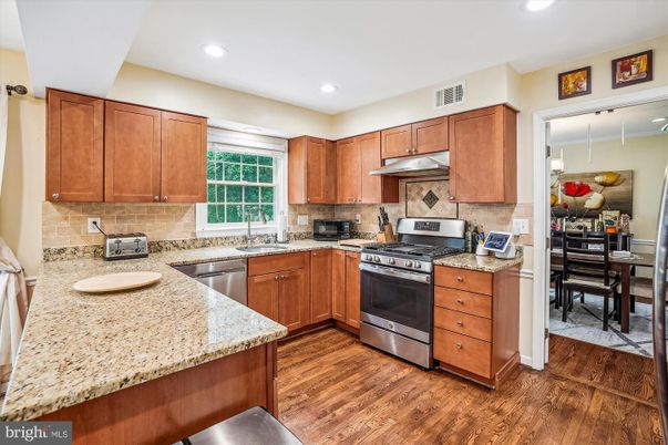 Dining room, Interior, Kitchen, Recessed Lighting, Stainless Steel Appliances, Wood Texture Flooring