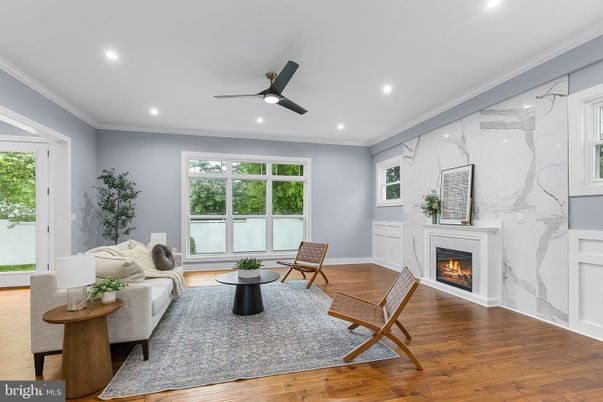 Fireplace, Interior, Living room, Marble Walls, Recessed Lighting, Wood Texture Flooring