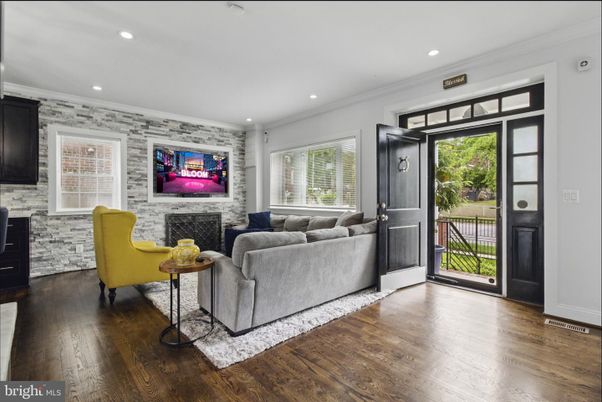 Fireplace, Interior, Living room, Recessed Lighting, Stone Walls, Wood Texture Flooring