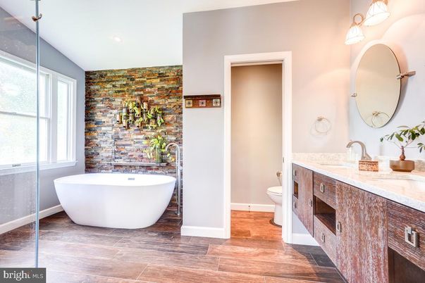 Bathroom, Dual Sink Vanities, Free Standing Baths, Interior, Recessed Lighting, Wood Texture Flooring
