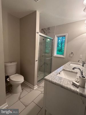 Bathroom, Dual Sink Vanities, Glass Shower, Interior, Marble, Marble Walls