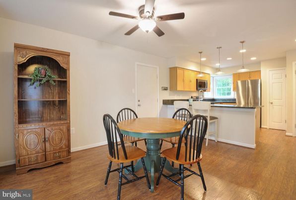 Dining room, Interior, Kitchen, Pendant Lights, Recessed Lighting, Stainless Steel Appliances, Wood Texture Flooring