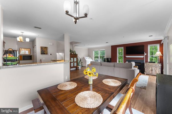 Dining room, Fireplace, Interior, Living room, Pendant Lights, Recessed Lighting, Wood Texture Flooring