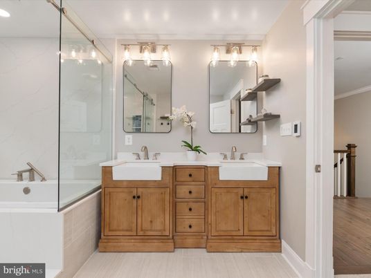 Bathroom, Dual Sink Vanities, Glass Shower, Interior, Marble Walls, Wood Texture Flooring