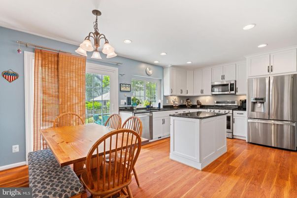 Chandelier, Dining room, Interior, Kitchen, Recessed Lighting, Stainless Steel Appliances, Wood Texture Flooring