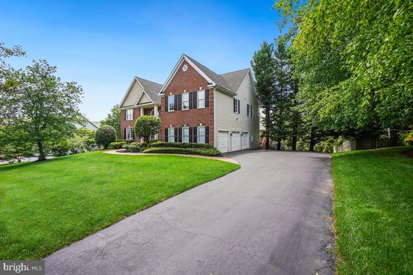 Attached, Backyard, Exterior, Facade, Brick Facade, Tudor Revival