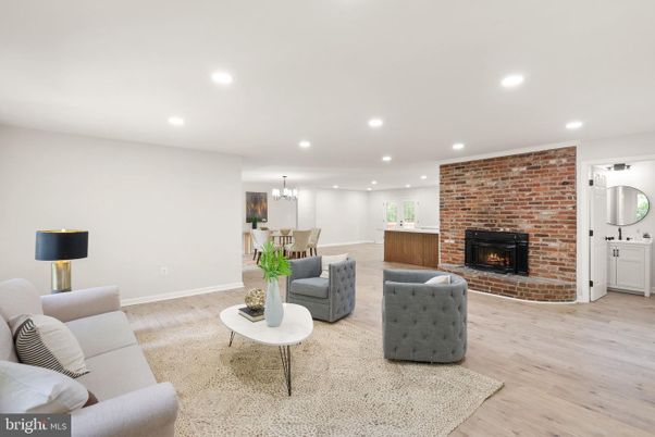 Chandelier, Dining room, Fireplace, Interior, Living room, Recessed Lighting, Stone Walls, Wood Texture Flooring