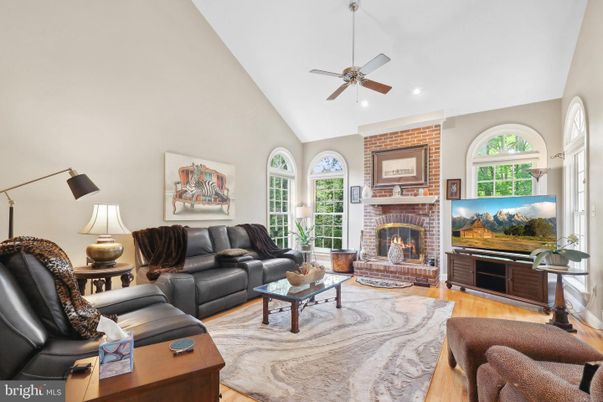 Fireplace, Interior, Living room, Recessed Lighting, Stone Walls, Wood Texture Flooring