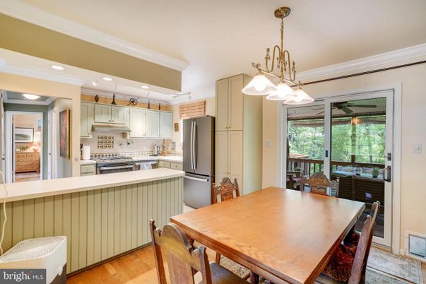 Dining room, Interior, Kitchen, Pendant Lights, Recessed Lighting, Stainless Steel Appliances, Wood Texture Flooring