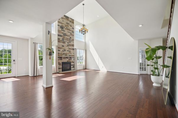 Chandelier, Empty room, Fireplace, Interior, Pendant Lights, Recessed Lighting, Wood Texture Flooring