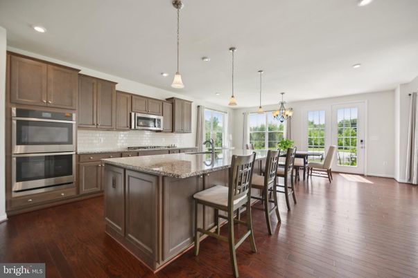 Chandelier, Dining room, Interior, Kitchen, Pendant Lights, Recessed Lighting, Stainless Steel Appliances, Wood Texture Flooring