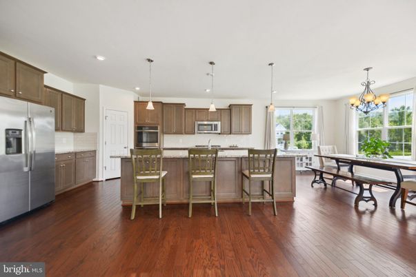 Chandelier, Dining room, Interior, Kitchen, Pendant Lights, Recessed Lighting, Stainless Steel Appliances, Wood Texture Flooring