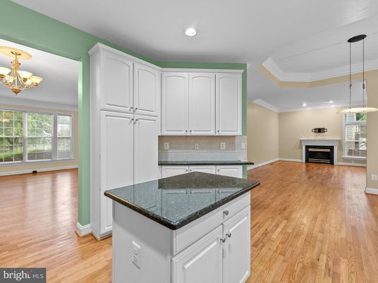 Empty room, Fireplace, Interior, Kitchen, Pendant Lights, Recessed Lighting, Wood Texture Flooring