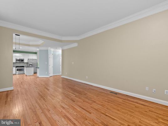 Empty room, Interior, Kitchen, Pendant Lights, Stainless Steel Appliances, Wood Texture Flooring