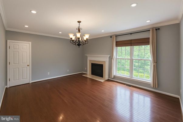 Chandelier, Empty room, Fireplace, Interior, Recessed Lighting, Wood Texture Flooring