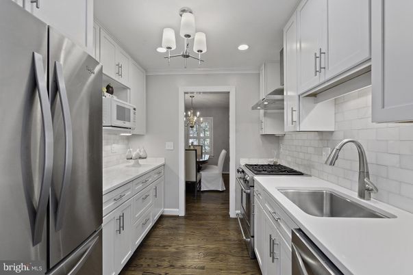 Chandelier, Dining room, Interior, Kitchen, Recessed Lighting, Stainless Steel Appliances, Wood Texture Flooring