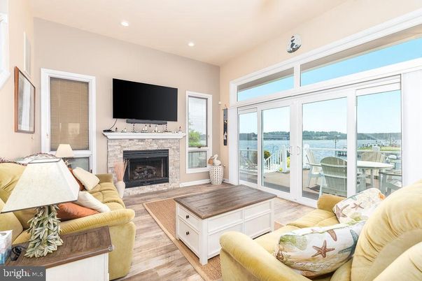Fireplace, Interior, Living room, Recessed Lighting, Water, Wood Texture Flooring