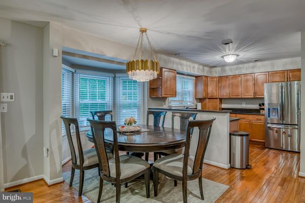 Chandelier, Dining room, Interior, Kitchen, Stainless Steel Appliances, Wood Texture Flooring