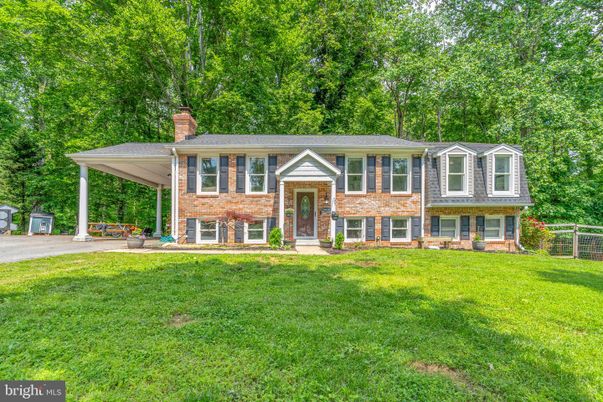 Backyard, Exterior, Facade, Brick Facade, Raised Ranch
