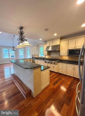 Chandelier, Interior, Kitchen, Pendant Lights, Recessed Lighting, Stainless Steel Appliances, Wood Texture Flooring