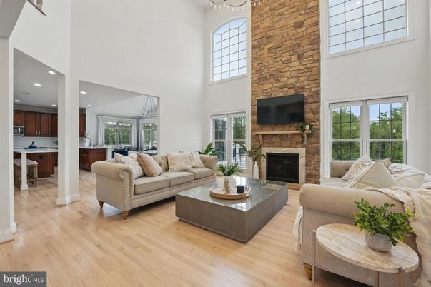 Fireplace, Interior, Living room, Recessed Lighting, Stone Walls, Wood Texture Flooring