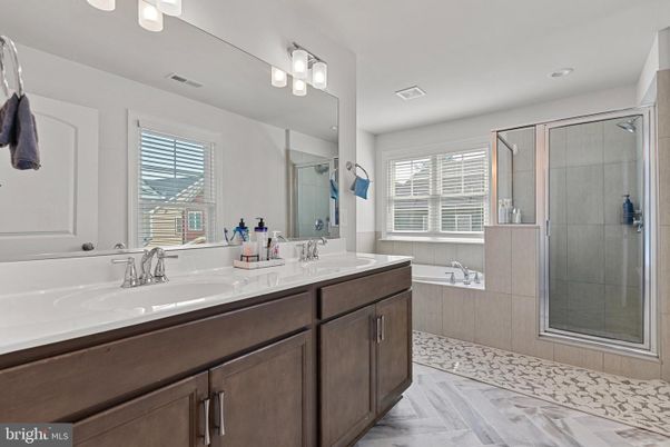 Bathroom, Dual Sink Vanities, Glass Shower, Interior, Recessed Lighting, Wood Texture Flooring