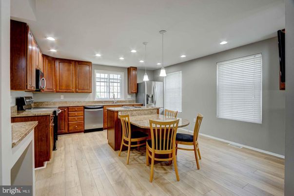 Dining room, Interior, Kitchen, Pendant Lights, Recessed Lighting, Stainless Steel Appliances, Wood Texture Flooring