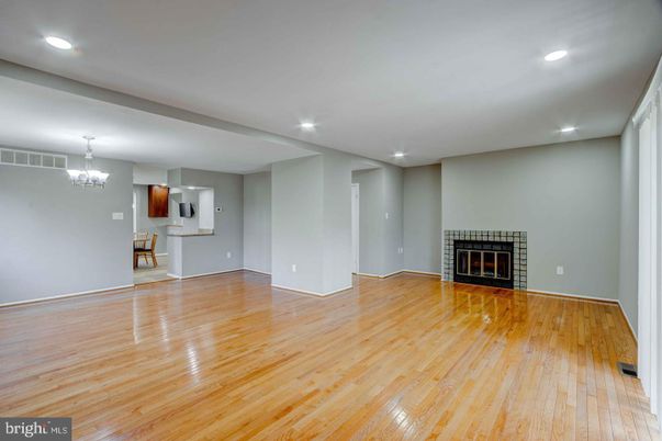 Chandelier, Empty room, Fireplace, Interior, Recessed Lighting, Wood Texture Flooring