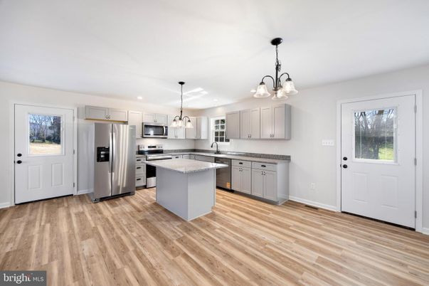 Chandelier, Interior, Kitchen, Pendant Lights, Recessed Lighting, Stainless Steel Appliances, Wood Texture Flooring