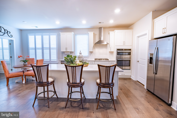 Dining room, Interior, Kitchen, Recessed Lighting, Stainless Steel Appliances, Wood Texture Flooring