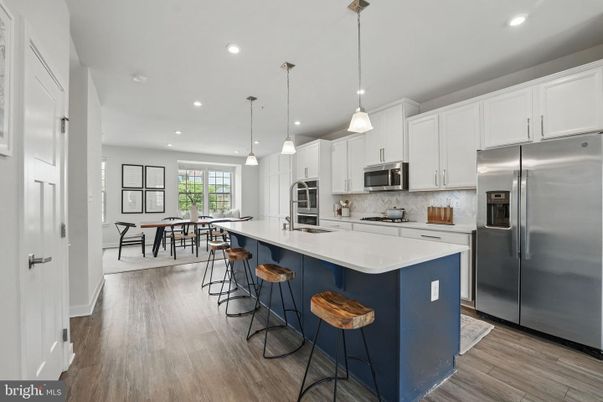 Dining room, Interior, Kitchen, Pendant Lights, Recessed Lighting, Stainless Steel Appliances, Wood Texture Flooring