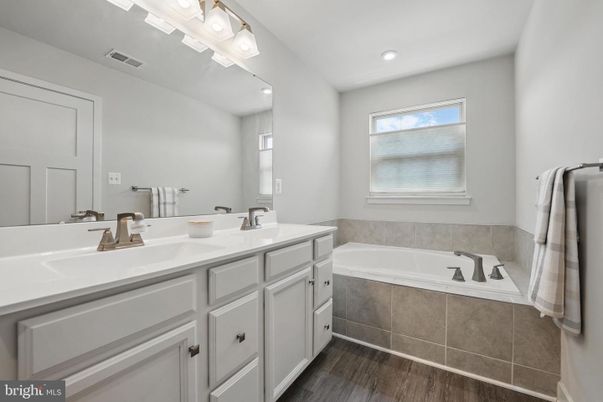 Bathroom, Dual Sink Vanities, Interior, Recessed Lighting, Wood Texture Flooring