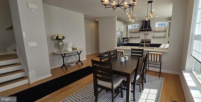 Dining room, Interior, Kitchen, Pendant Lights, Recessed Lighting, Stainless Steel Appliances, Wood Texture Flooring