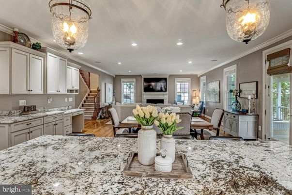 Chandelier, Dining room, Fireplace, Interior, Living room, Recessed Lighting, Wood Texture Flooring
