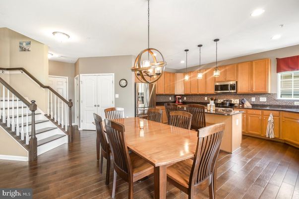Chandelier, Dining room, Interior, Kitchen, Pendant Lights, Recessed Lighting, Stainless Steel Appliances, Wood Texture Flooring