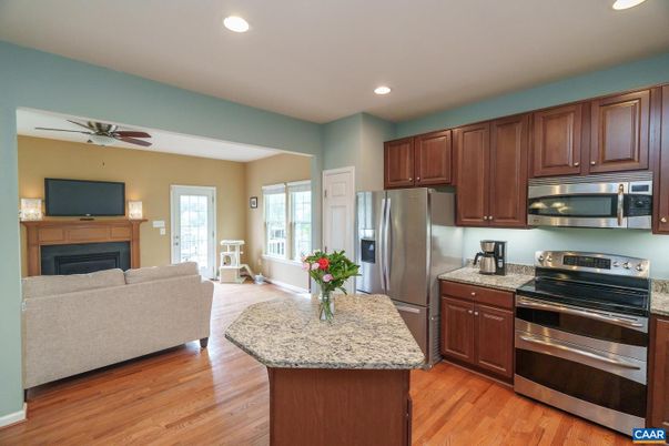 Fireplace, Interior, Kitchen, Recessed Lighting, Stainless Steel Appliances, Wood Texture Flooring