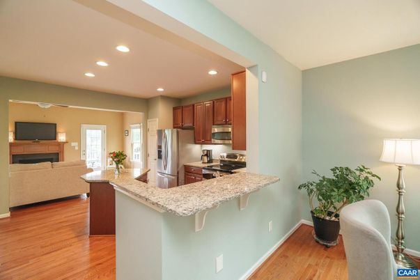 Fireplace, Interior, Kitchen, Living room, Recessed Lighting, Stainless Steel Appliances, Wood Texture Flooring